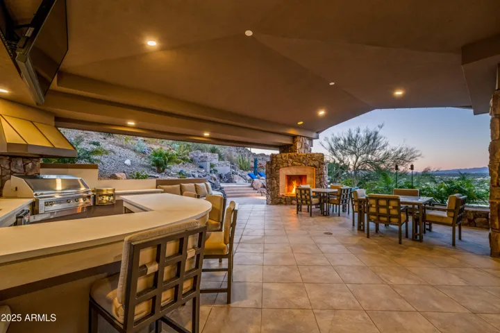 Features Include: Two Separate BBQ Areas w/ Sinks, Outdoor Fireplace, Outdoor Firepit, Misters, Outdoor TV, Outdoor Sound System
