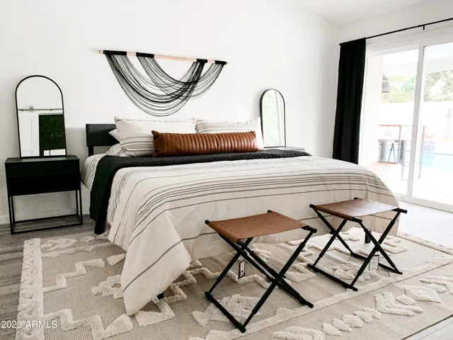 Primary Suite with slider to backyard + ensuite bath with walk in shower + separate tub + walk in closet