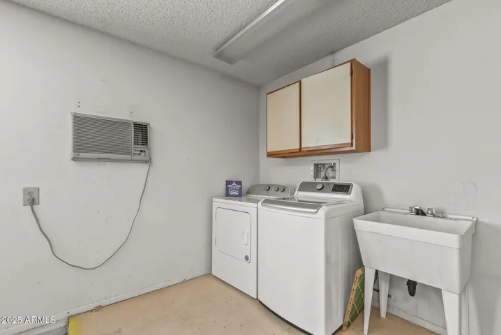 The laundry nook keeps the heat and noise out of the house.