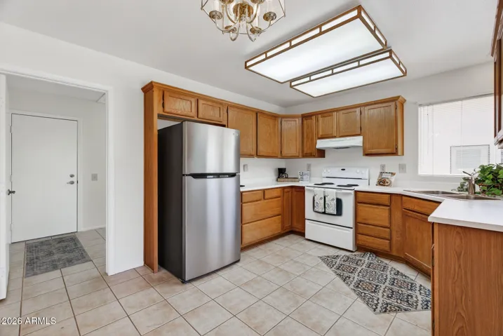 Enter from the garage & thru the utility room right into the kitchen.