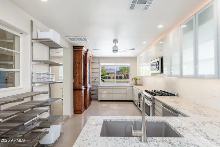 The kitchen runs the full depth of house