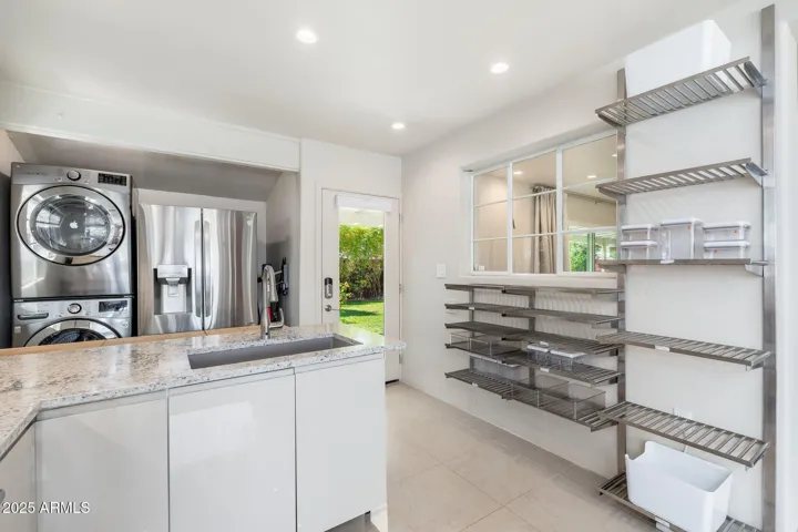 Open pantry inspired by commercial kitchens where foods are stored in airtight containers with easy access