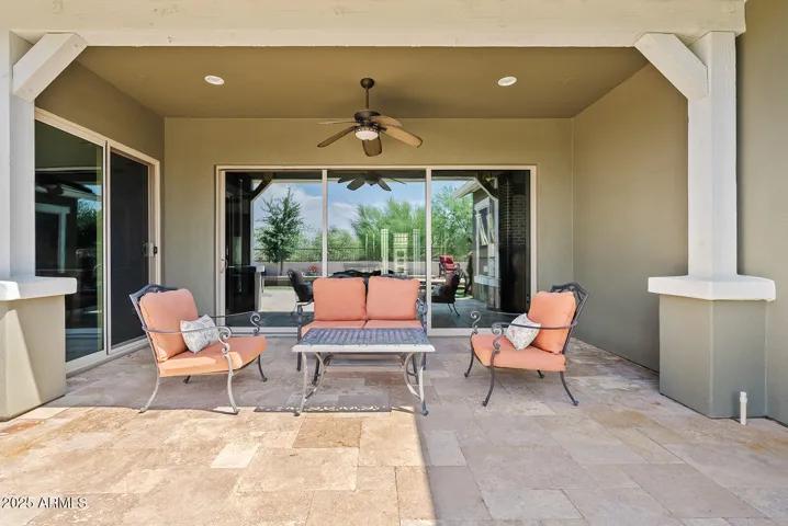 Relax in the shade beneath the extended covered patio with ceiling fan and cozy lounge area. This tranquil Phoenix retreat is perfect for enjoying Arizona’s weather year-round.