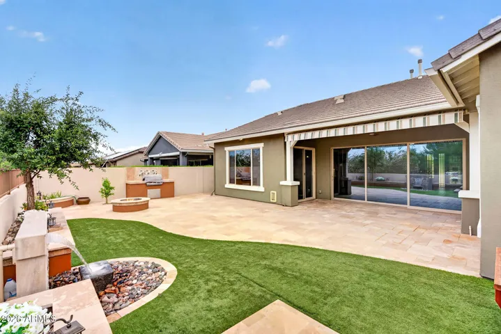 The patio flows effortlessly into the main living areas through oversized sliding doors, enhancing the indoor-outdoor lifestyle. A peaceful and private space to relax or host in Phoenix’s desirable setting.