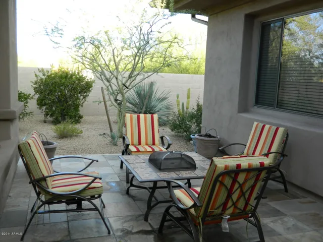 Front courtyard with cozy seating and fire pit.