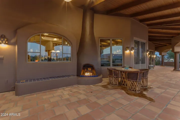 Outdoor fireplace on pool patio