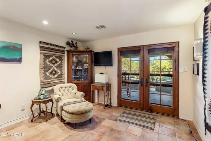 Bonus room overlooking lush vegetation with french doors out to patio