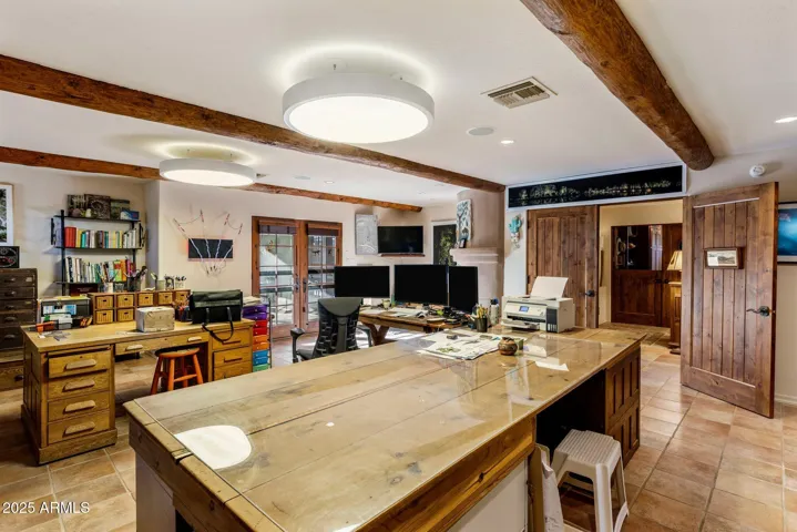 Oversized primary Suite 1 (currently used as office) with sitting area and fireplace