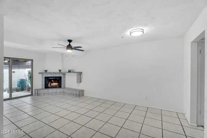 Living room and dining room with new light fixtures and ceiling fan