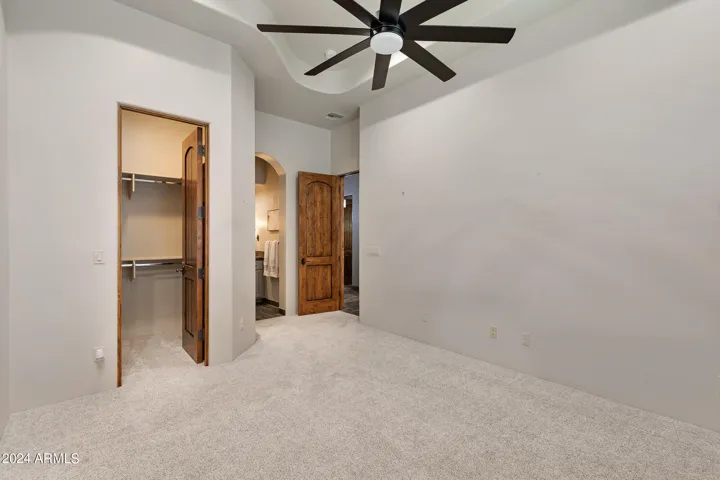 Secondary bedroom with walk in closet and private bath.