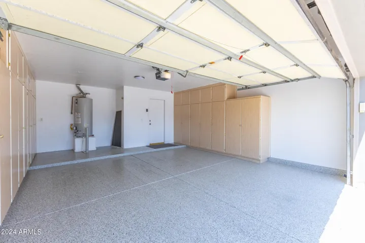 GARAGE WITH NEW EPOXY FLOORING AND LOTS OF CABINET SPACE!