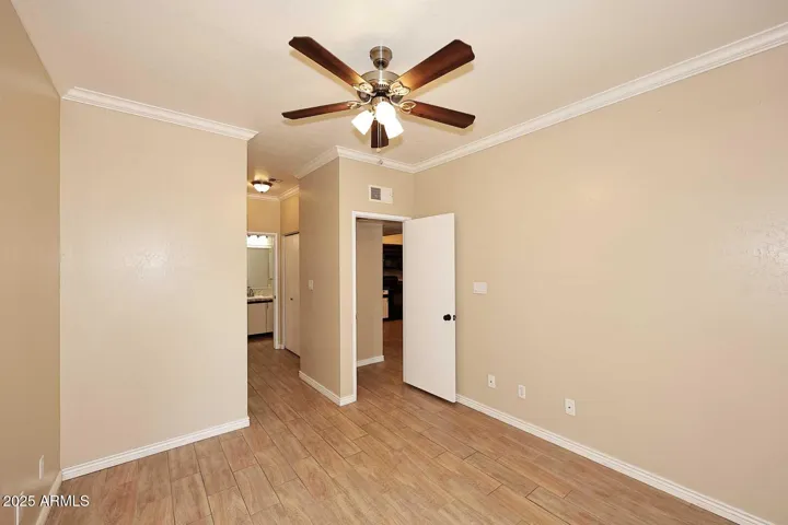 Spacious primary suite with laundry room, walk-in closet, spa-like bath & exit to dining room!