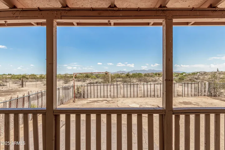 back patio overlooking fenced yard