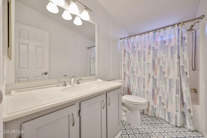 2nd bath with newer flooring and newer vanity and top.