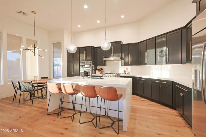 Updated Kitchen with Quartz Counters, Shaker Cabinets & Gas Z-Line Range!