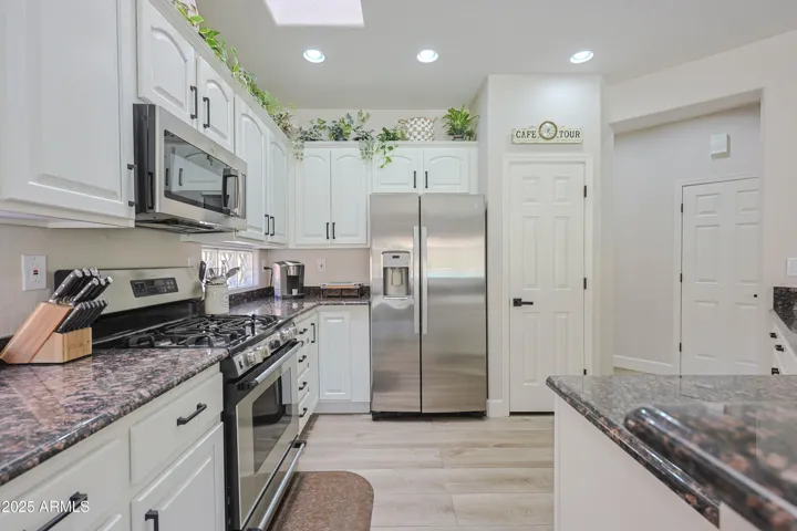 Granite & Stainless Kitchen with White Cabinets!