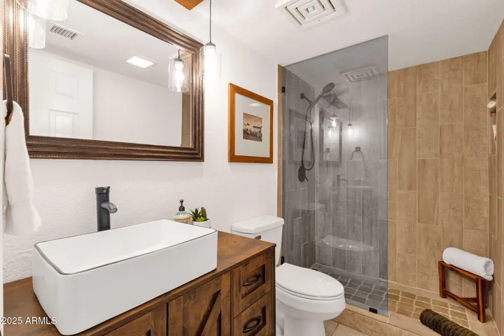 42" Vanity With Porcelain Vessel Sink And Porcelain Tiled Shower With Fixed Glass Panel