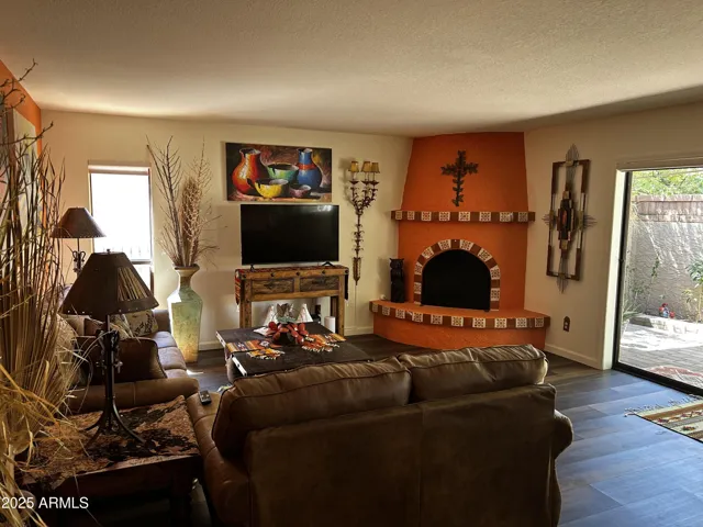 Family Room w/ Kiva Fireplace #CarefreeLiving #ArizonaLuxuryRental #SeasonalLuxuryHome #VacationInStyle