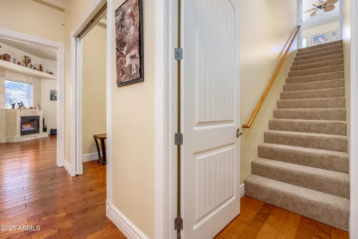 To upstairs Media Room w/ sleeping accommodations, wetbar, bathroom, & walk-in closet