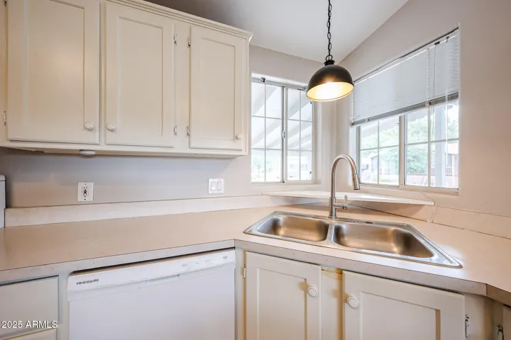 Sink has kitchen window looking to front