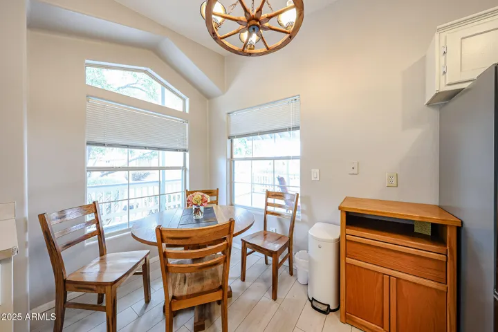 Nook area for kitchen table looks out to front