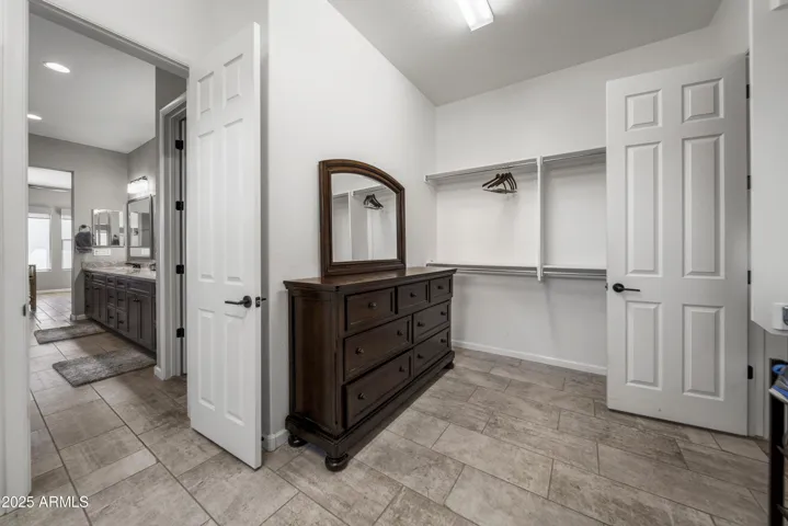 2nd Primary closet open to the Laundry Room