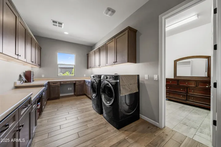 Door from Smart Room/Laundry Room to 1 of the Primary Closets