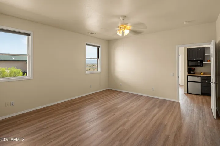 New Flooring, sitting room, and Kitchenette.