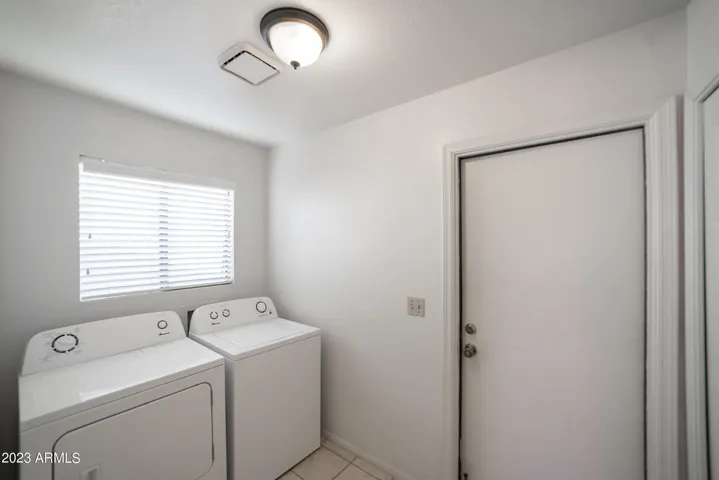 The inside laundry room is off the garage leading to the kitchen. Washer-dryer included. Check out the Costco sized pantry.