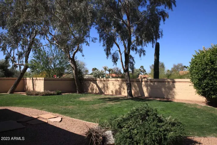 The lush green rear yard is spacious and tranquil. The landlord pays to cut the grass.