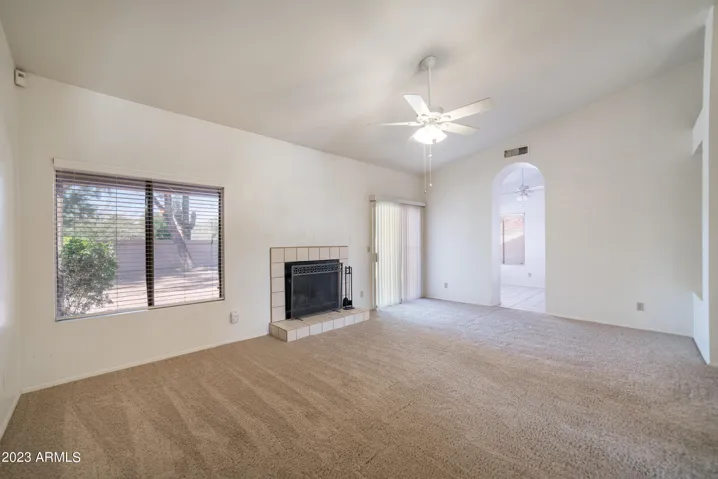 Big picture window and Arcadia door in living room are attractive features.
