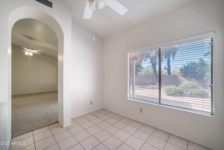 Enjoy meals and snacks with a view of the private rear yard in this sunny breakfast nook.