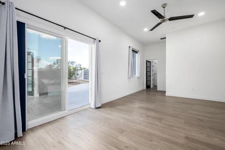 Master bedroom leads to Second Patio at Rear grounds with built in- BBQ area. . Room to build resort inspired grounds!
