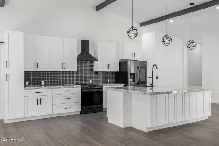 Kitchen island is perfectly placed and oversized! Perfect for entertaining.