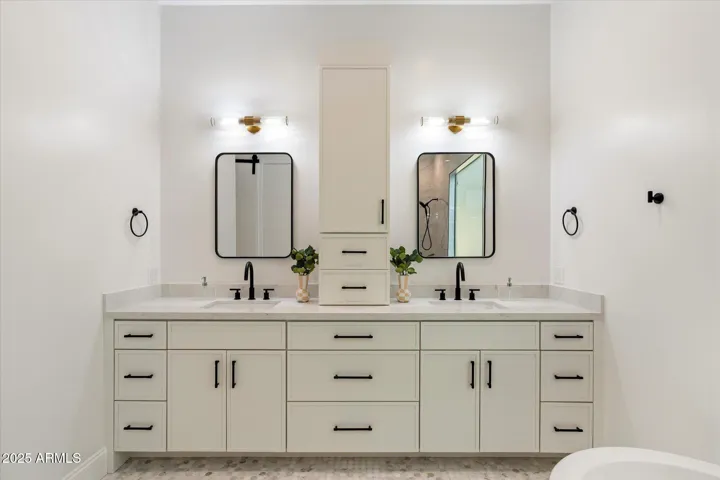 DUAL VANITY WITH A TOWER IN THE PRIMARY