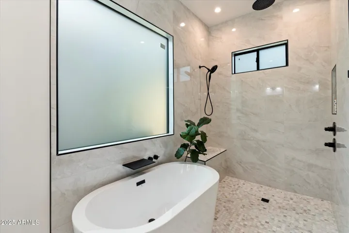 SEPARATE SHOWER AND TUB IN THE PRIMARY BEDROOM