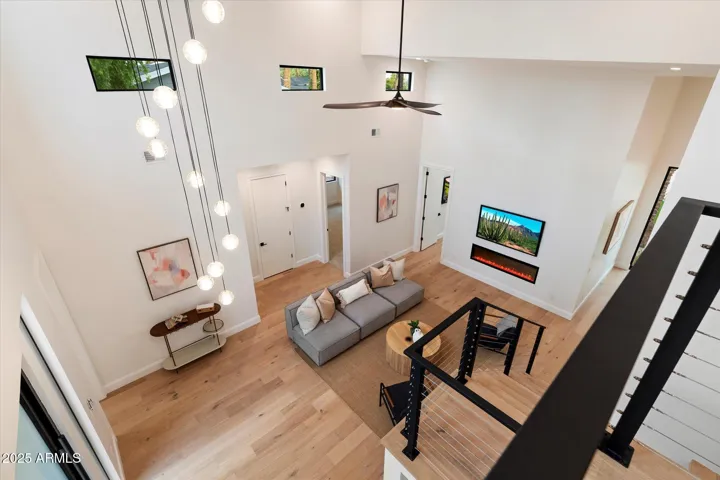 VIEW OF DOWNSTAIRS SITTING AREA FROM LOFT
