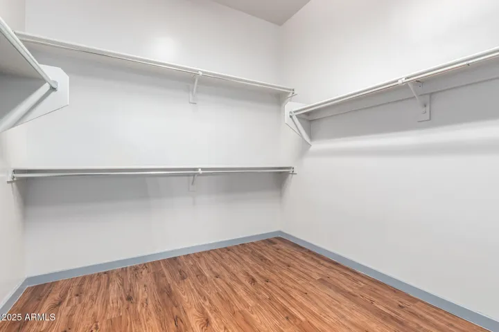 LARGE MASTER CLOSET- LAMINATE WOOD FLOORING