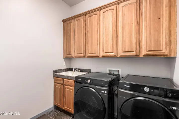 LAUNDRY ROOM (INSIDE)- FULL SINK AND STORAGE