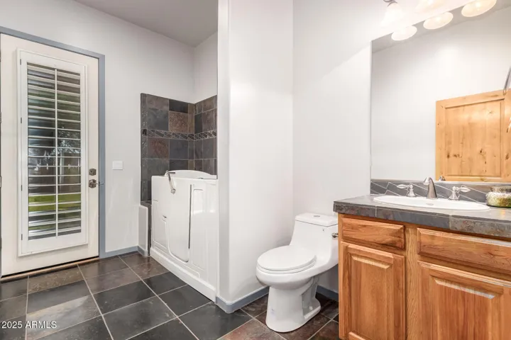 BATHROOM #3- FULL WALK-IN TUB AND SHOWER. BACK ENTRANCE TO THE BACKYARD