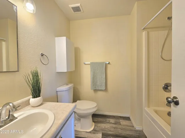 Full bathroom with tub/shower combo.