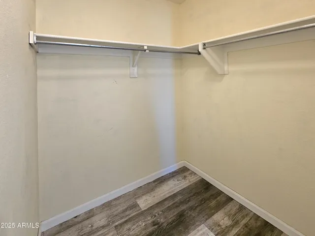 3rd bedroom walk-in closet with built-in shelving.