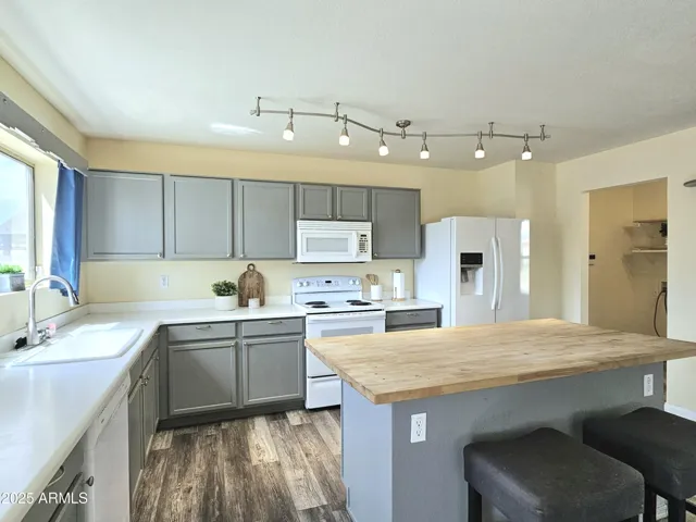 Stylish two-tone kitchen with plenty of storage and natural light.