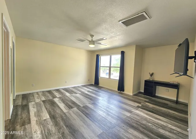 Spacious primary bedroom with flexible layout options. TV included!