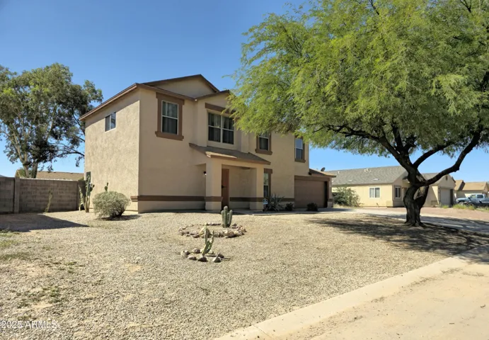 Charming two-story with a spacious front yard.