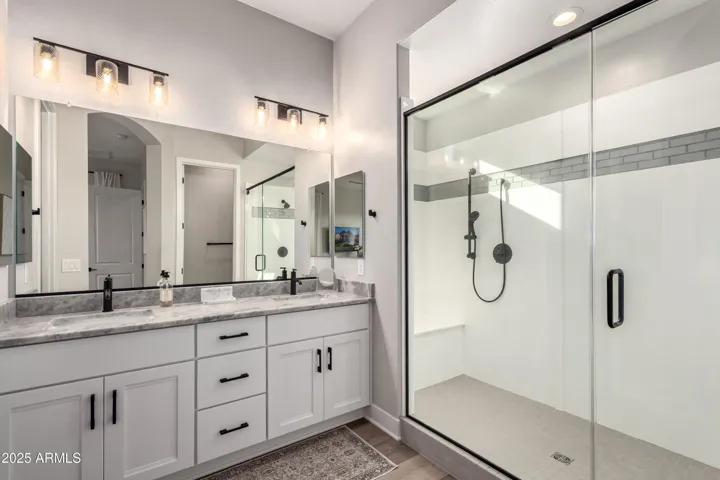 Spa Shower at Main Bath, Double Sinks, Private Toilet.