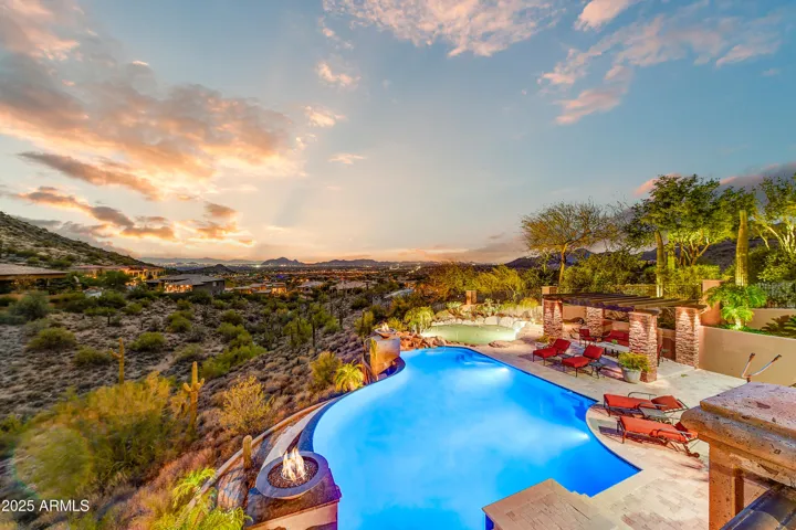 From the elevated terrace, take in sweeping desert and city views alongside the crystal-clear pool and lush landscaping. The beautifully designed backyard is your private retreat with top-tier amenities and unmatched Arizona sunsets.