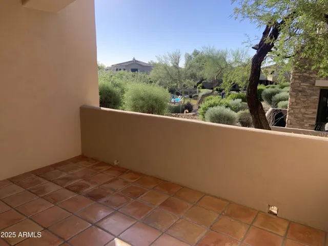 One of two covered patios with gorgeous sunset & pool views off master & dining