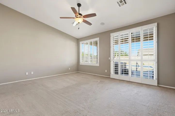 Primary bedroom suite with plantation shutters