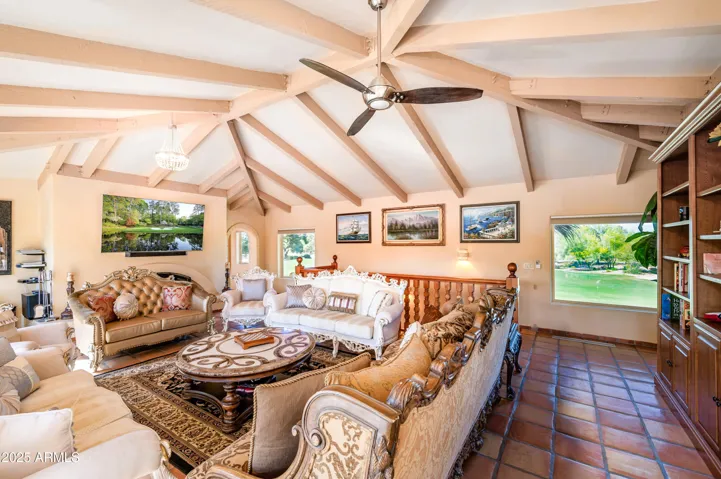View of golf green, golf course and mountains from 14 massive picture windows with remote-controlled electronic Levolor window shades in the Great Room with Beverly Hills' Marge Carson furnishings.